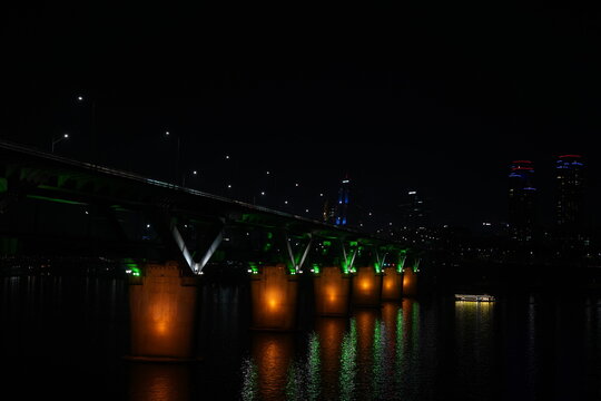 Beautiful night view of Hangang Bridge with city light trails in Seoul, South Korea - Night view of Han River and Ttukseom hangang park cheongdamdaegyo Bridge 청담대교 한강야경