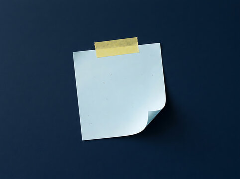 Blank sticky note taped on a dark blue background