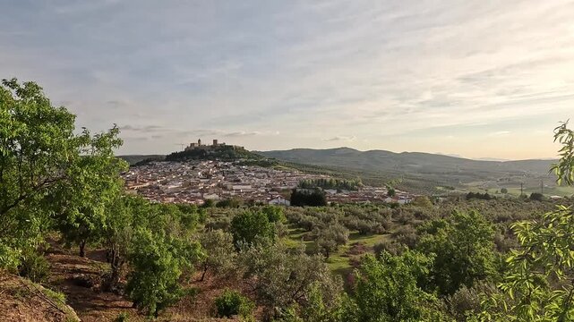 Fortaleza de la Mota fortress and abbey church on the hilltop above Alcala la Real, olive groves at dusk, Jaen, Andalucia, Spain