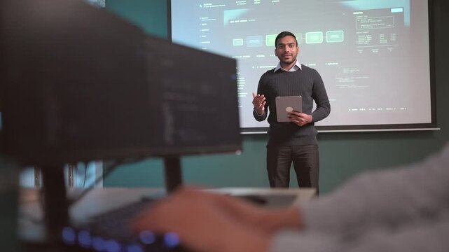 Male business executives review detailed financial analytics displayed on a digital screen, evaluating market performance, revenue forecasts, investment opportunities, and competitive trends while dev
