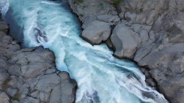 Aerial view of a whitewater chute rushing through jagged rocks