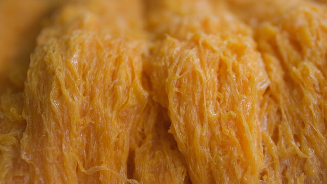 Close up golden egg yolk threads (Foi Thong) a popular traditional Thai sweet dessert.