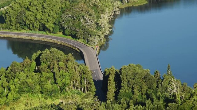 Aerial view of road curving between the twin crater lagoons of Lagoa das Sete Cidades, Sao Miguel, Azores, Portugal