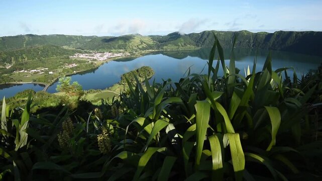 Miradouro do Cerrado das Freiras a crater-rim view over lush foliage to Lagoa Azul, Lagoa Verde and the village below, Sete Cidades, Sao Miguel, Azores