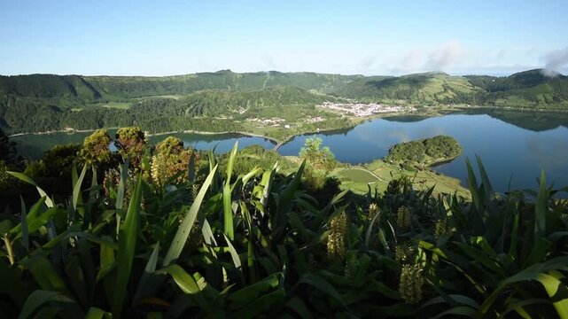 Sweeping caldera panorama over the twin lagoons and Sete Cidades village to the sea, Miradouro do Cerrado das Freiras, Sao Miguel, Azores, Portugal