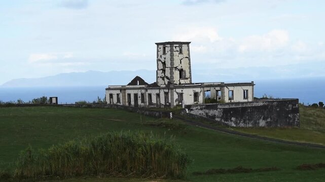 The Farol da Ribeirinha lighthouse, wrecked by the 1998 earthquake, on Ponta da Ribeirinha, Faial, Azores, Portugal