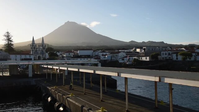 Coastal settlements scattered along the lower flank of Mount Pico above the surf line, Pico, Azores, Portugal