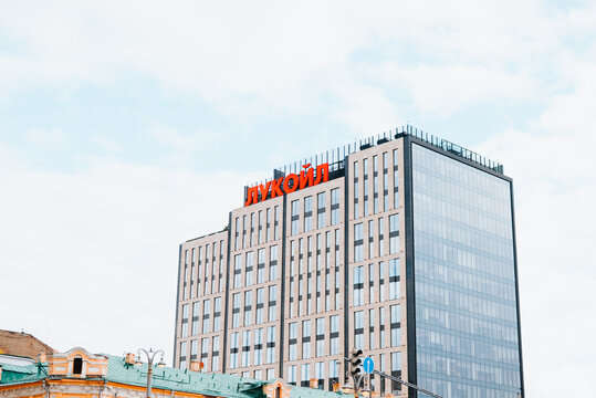 Moscow, Russia 08.26.2026 tall building in an urban area with a visible sign Lukoil on the top floor.