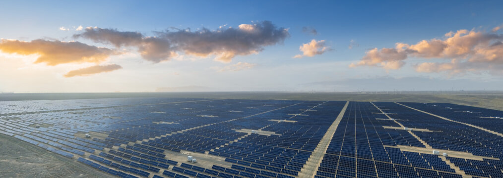 Aerial View of Vast Solar Power Station in Desert Gobi Landscape at Sunset