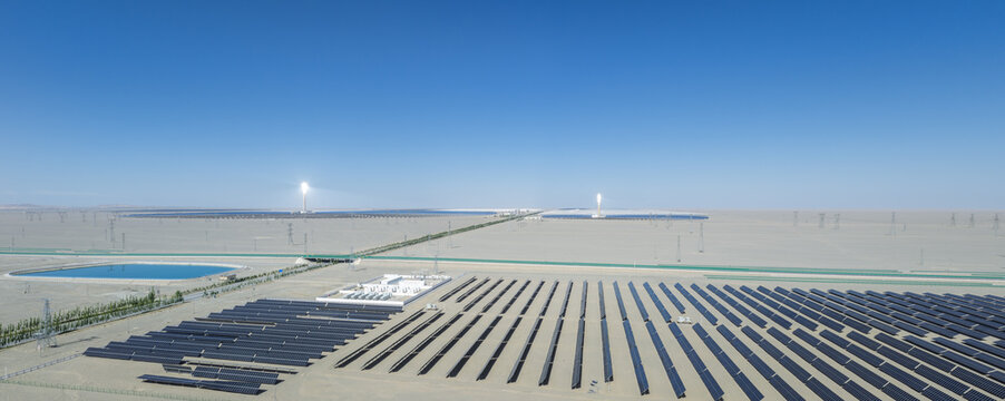 Aerial Panorama of Solar Photovoltaic Farm and Molten Salt Thermal Power Towers in Dunhuang Desert