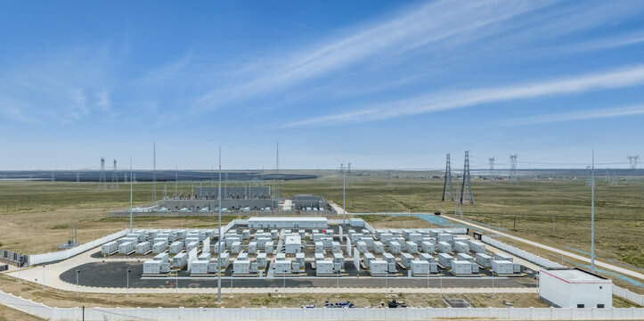 Aerial View of Battery Energy Storage Power Station on Arid Grassland with Solar Farm and Substation