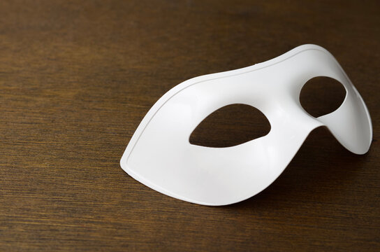 Anonymous Identity and Privacy Concept with White Mask on Table