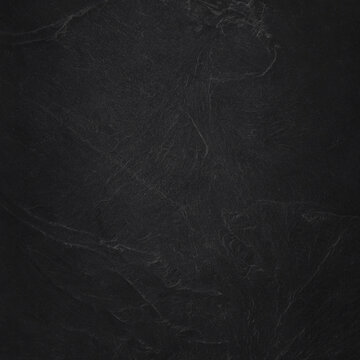 Dark grey black slate texture in natural pattern with high resolution for background and design art work. Black stone wall.