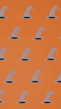 Animation of falling witchs hats on orange background