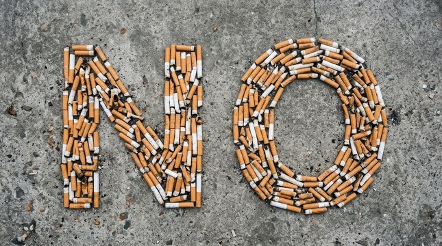 No Smoking Message Made From Cigarette Butts On Concrete
