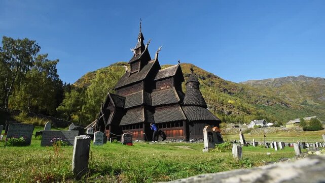 Borgund Stave Church seen across gravestones, Laerdal, Vestland, Norway