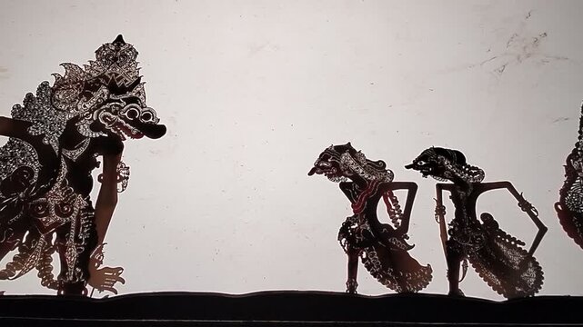 Silhouette of Wayang Kulit, a traditional Javanese shadow puppet performance recognized by UNESCO as a Masterpiece of Oral and Intangible Heritage of Humanity.