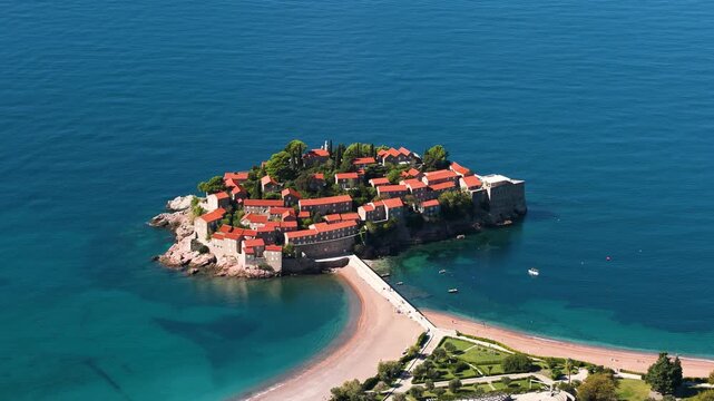 View of Sveti Stefan, a small island with Mediterranean architecture on the coast of Montenegro