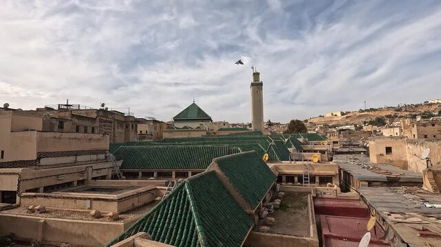 Green glazed roofs and minaret of Al-Qarawiyyin across the Fez medina, Fes-Meknes, Morocco