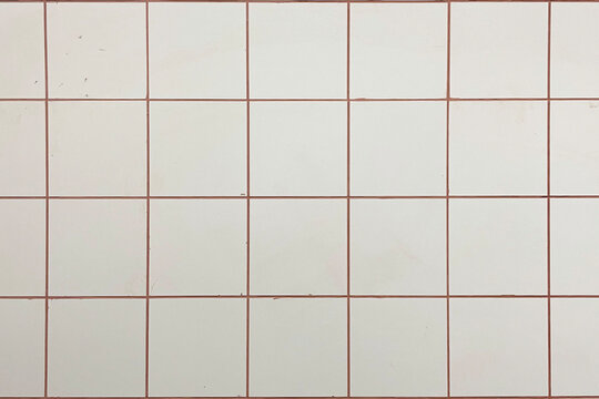Decorative precut tile texture featuring a clean tiled surface with subtle orange linear accents between the tile sections. The realistic material has a balanced, evenly distributed appearance with na