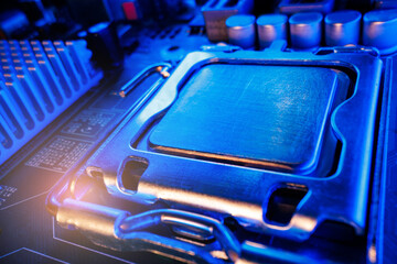 Obraz premium Extreme closeup of processor seated in motherboard socket with blue lighting for hardware background and tech design
