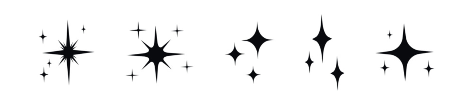 Collection of sparkling starbursts and glints on a white background