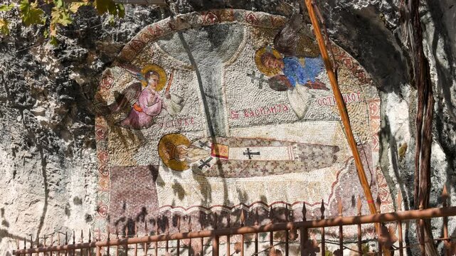 Religious rock mural art at Ostrog Monastery in Montenegro