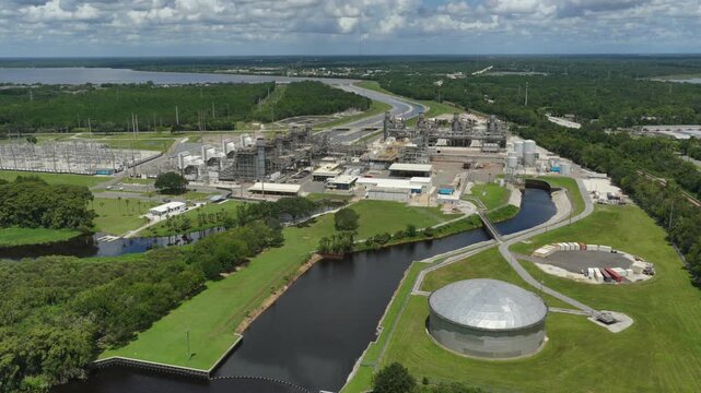 Aerial view of FPL Sanford Power Plant featuring industrial facilities, storage tanks, and surrounding greenery in DeBary, Florida, United States.