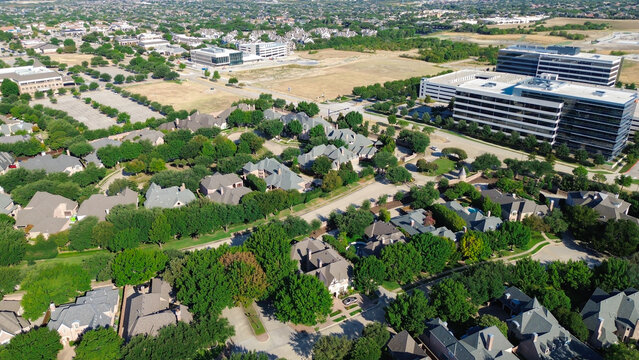 High-density corporate developments border residential greenspaces along Internet Boulevard. Modern office parks merge with established North Texas suburban neighborhoods, Frisco, Texas