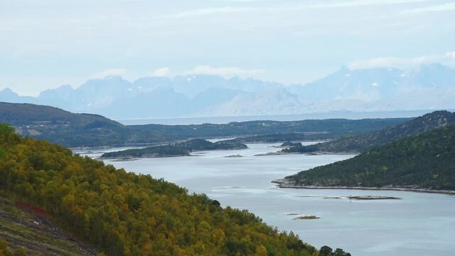 Fjord inlets and wooded islets with the Lofoten range beyond, near Bodo, Nordland, Norway
