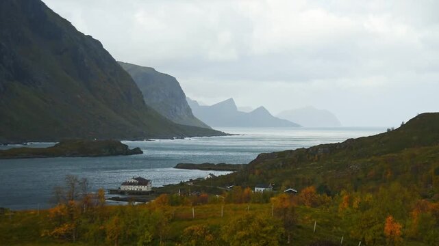 Autumn coast with a lakeside house over Steinfjorden from the Sortland viewpoint, Lofoten, Norway