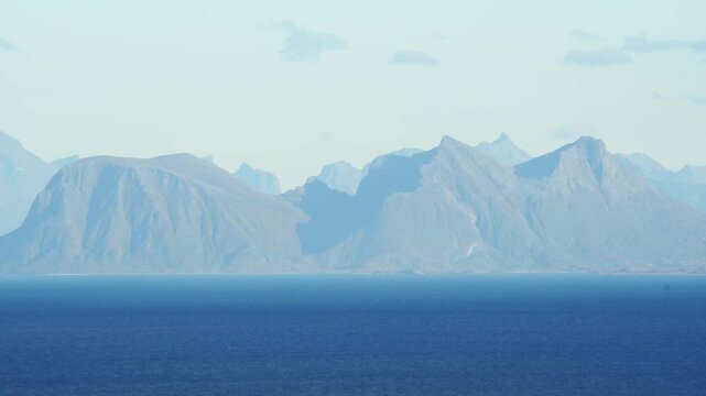 Steep island massifs receding into blue haze, Lofoten, Nordland, Norway