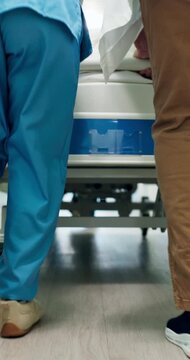 Legs, people and rush in hospital with stretcher, admission and emergency for urgent surgery. Feet, doctor or nurse hurry in lobby with gurney, critical care and operation room for healthcare service