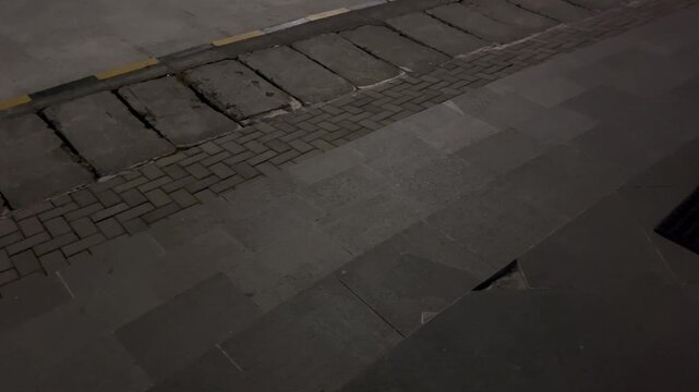 Diagonal Camera Pan of Empty Urban Sidewalk and Brick Pavement