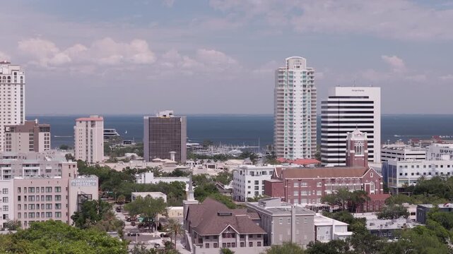 Cinematic telephoto aerial footage of urban mural and downtown architecture in St. Pete, FL. 