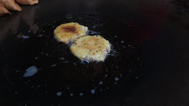 Aloo Tikki getting deep fried 