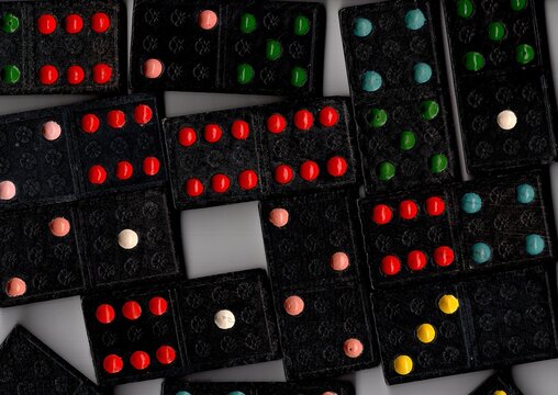 A close up detail of black vintage dominoes.