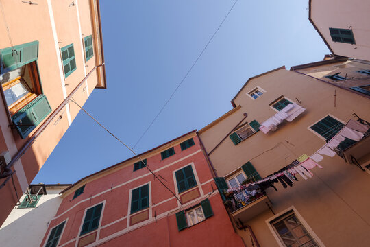 Colorful facades of houses in the historic center of Imperia, Liguria region, Italy