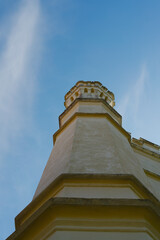 Low Angle View of an Antique Stone Tower Against a Blue Sky © Kamil