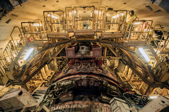 Worker inspects a tunnel boring machine