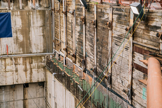 Construction site with reinforced concrete and wooden retaining walls