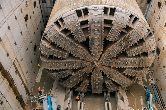 Large tunnel boring machine inside concrete construction site