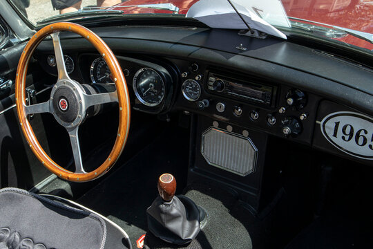 Tavernes Blanques, Spain - June 14, 2026.MGB Roadster dashboard and central console featuring vintage control knobs and wooden gear shift in classic sports car design