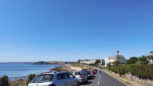 Falmouth Cornwall UK. 13.08.2026. Video. Driving along clifftop road with a sea view and Castle Beach Falmouth England in slow motion.