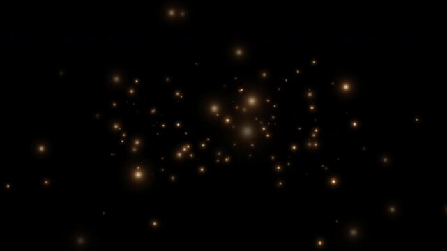 Smoothly flying glowing particles on a black background. Golden particles, shimmering light particles, magical golden dust. 4K video.