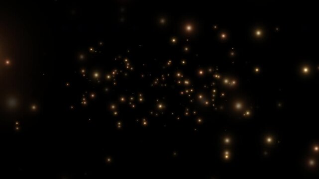 Smoothly flying glowing particles on a black background. Golden particles, shimmering light particles, magical golden dust. 4K video.