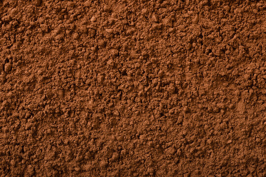 Food background of raw cocoa powder, top view.