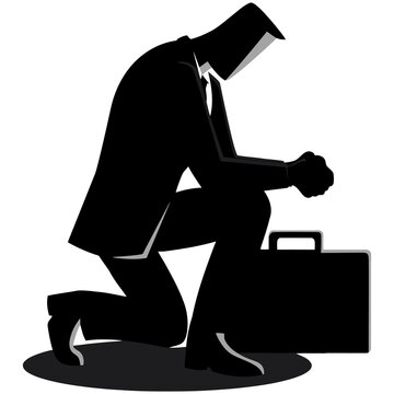 Defeated businessman kneeling on the floor representing professional struggle or loss