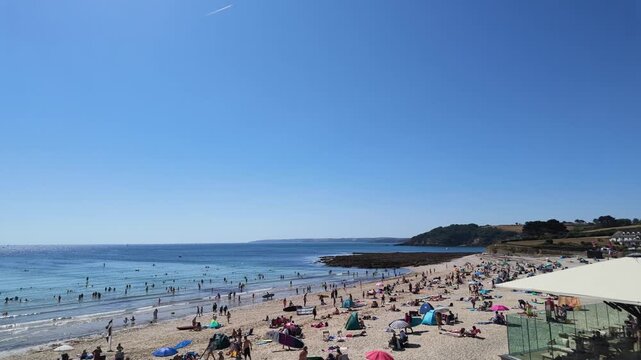 Falmouth Cornwall England UK. 13.08.2026. Video. View over Castle Beach Falmouth  with holidaymakers enjoying the sunny day.