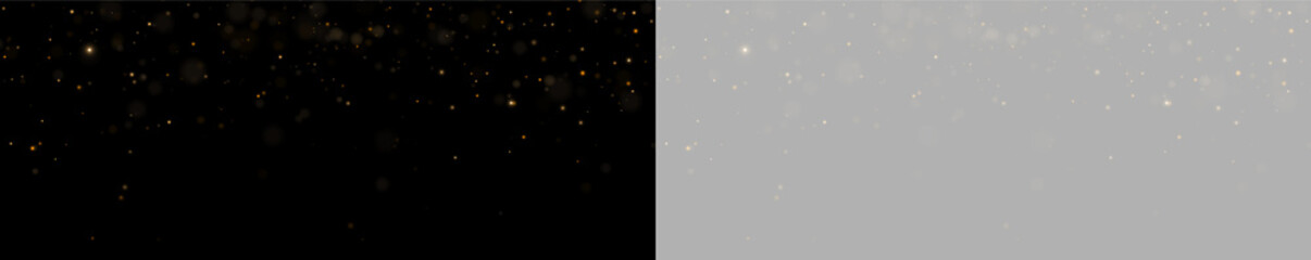 A cascade of soft golden glitter particles scatters gently across a black background. The scattered dots vary in size and intensity, creating a sense of depth and twinkle. © rocoverystock